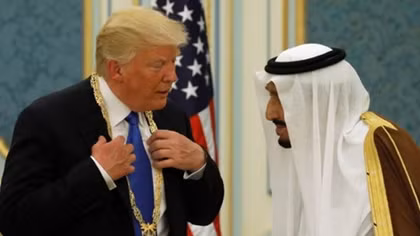 Under fire at home, Trump wins warm welcome in Saudi