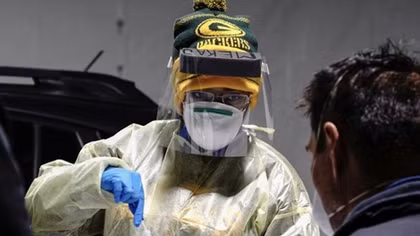 U.S. sets single-day record for COVID-19 cases during new surge