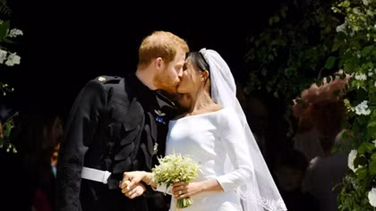Newlyweds Harry and Meghan process through Windsor