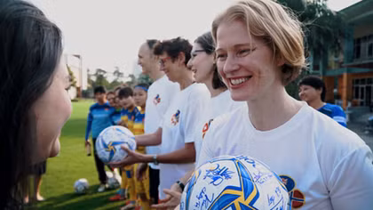 Ambassadors send Tet greetings, gender equality messages with female footballers