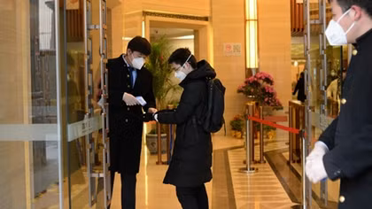 Nearly 100 more die from coronavirus in China, workers start to return to offices and factories