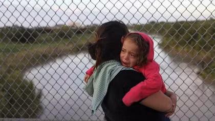 U.S. government says it will detain migrant children with parents