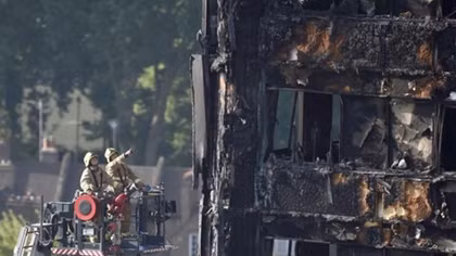 Faced with mounting criticism, British PM visits London fire victims