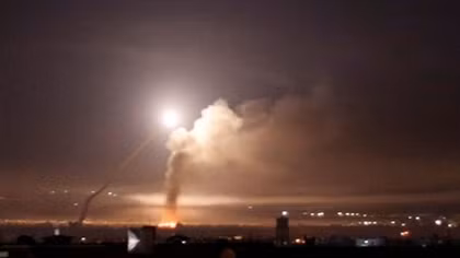 Israel says it attacked targets in Syria after Iranian rocket fire