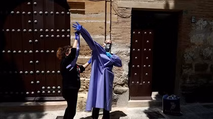 Spain's coronavirus death toll slows, with lowest increase in about a month