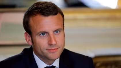 Macron's likely landslide lifts markets, low turnout clouds celebration