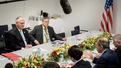 Russian foreign minister meets with Tillerson, denies interfering