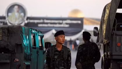 Thai forces besiege temple in standoff over monk