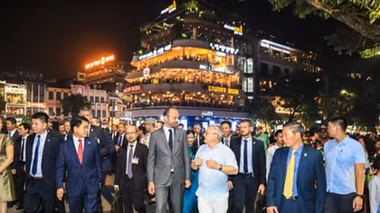 French Prime Minister Édouard Philippe walks about Hanoi pedestrian streets