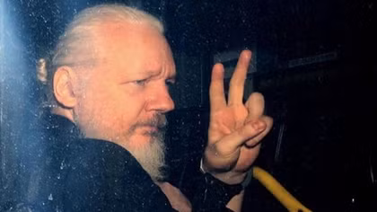 Julian Assange sentenced to 50 weeks in jail for jumping bail in UK
