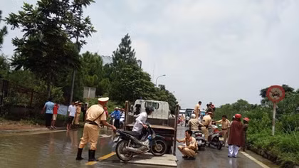 Hanoi Traffic police use special function vehicles to transport people through flooded areas