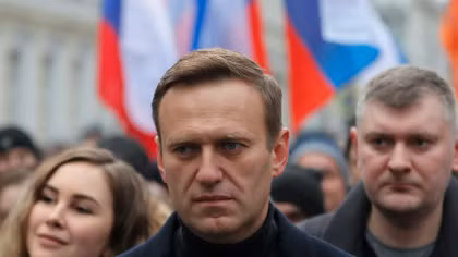 Kremlin critic Navalny is flown to German hospital