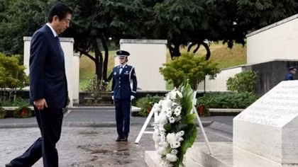 Japan's Abe pays respects at Hawaii memorials on eve of Pearl Harbor trip