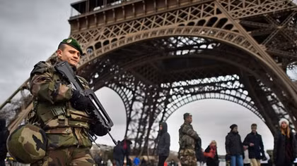 French President Emmanuel Macron signs controversial anti-terror law