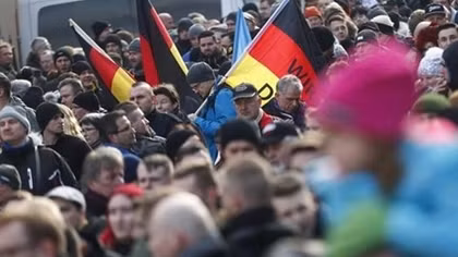Arab refugees march against hate in German city hit by rising tensions
