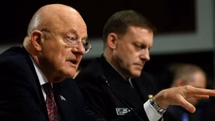U.S. spy chief 'resolute' on Russia cyber attack, differs with Trump