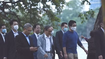 Japan's Prime Minister Suga takes morning walk around Hoan Kiem lake
