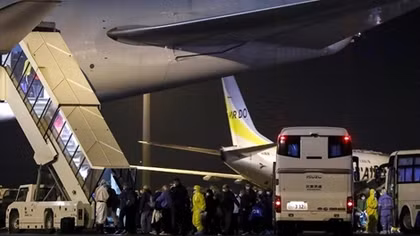 Hundreds of Americans flown home from cruise ship, 14 with coronavirus