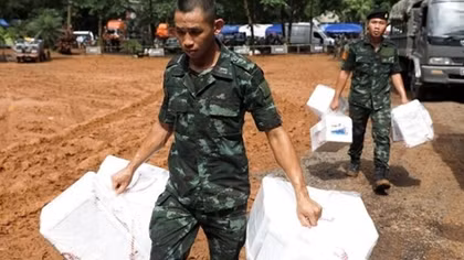 Unable to find lost boys, Thai police drop survival packages into cave