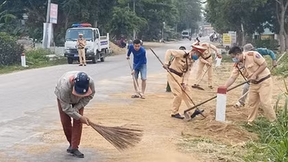 Traffic police clear up stones spilled over on the road
