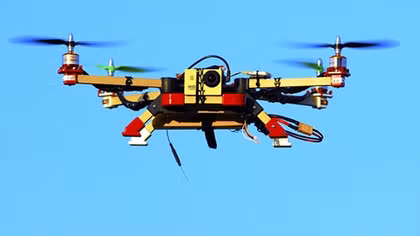 Chinese electric company uses flame-throwing drones to clean power lines