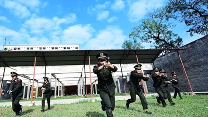 Students of People's Security Academy practice shooting 