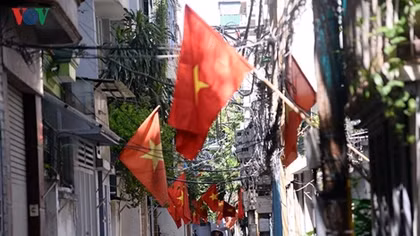 Streets painted red with national flags for National Day