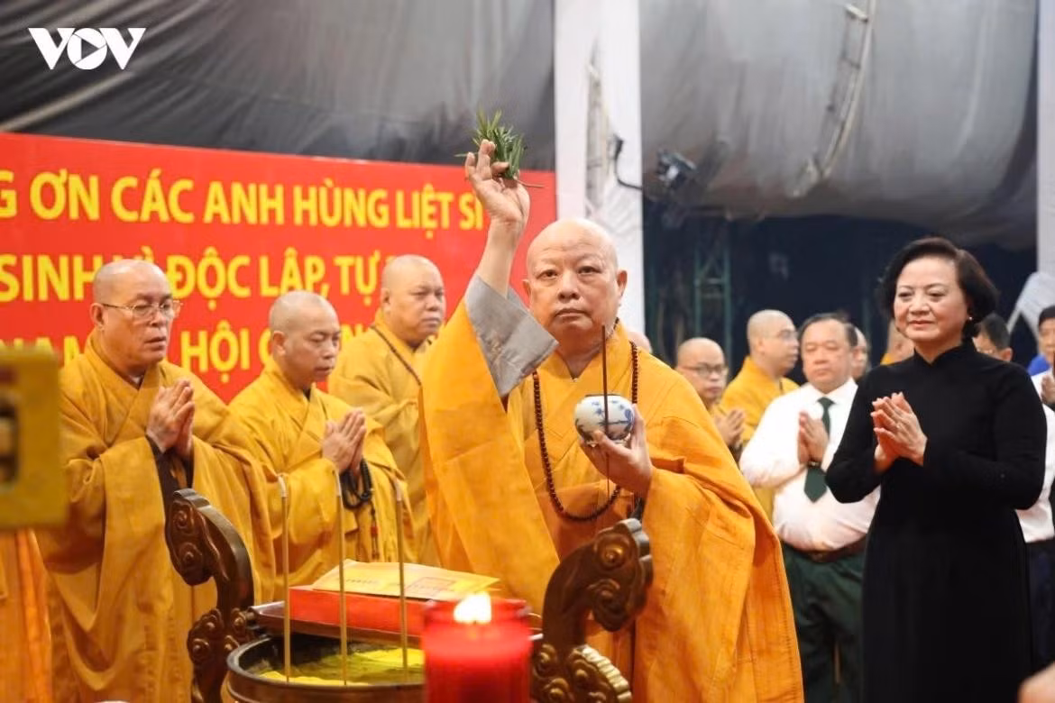 Buddhist monks perform a solemn ritual during the memorial service for 731 sets of fallen soldiers' remains.