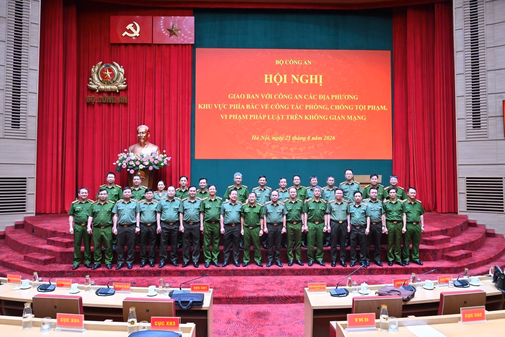 Delegates pose for group photo.
