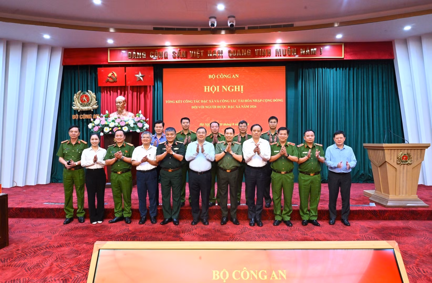Delegates pose for group photo.