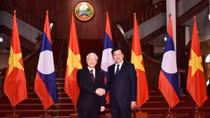 Top Vietnamese leader seeks stronger relations with Laos