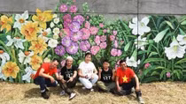 French, Vietnamese flowers featured on dyke wall along Seine river bank