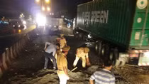 Traffic police force backfill sinkholes on the road