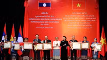 Friendship orders presented to Lao NA collectives, individuals