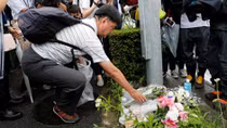 Kyoto Animation fire: police search for clues as donations pass $1m mark