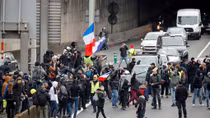 Paris police fire tear gas on 'yellow vest' protests anniversary