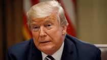 Trump, seeking to calm political storm over Putin summit, says he misspoke