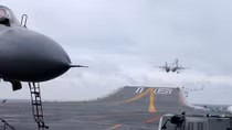 Wary of Trump unpredictability, China ramps up naval abilities