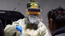 U.S. sets single-day record for COVID-19 cases during new surge