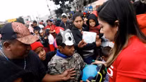 Central American 'caravan' women and children enter U.S., defying Trump