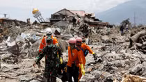 French rescuers search for bodies in debris of Indonesian quake disaster