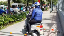 HCM City resorts to motorbike barriers on sidewalks