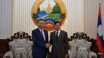 Minister To Lam visits Lao People's Democratic Republic