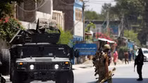 Afghanistan attackers take dozens hostage in eastern city