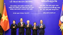 Party and State of Laos honor senior leaders of Vietnam with noble orders