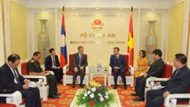 Minister To Lam receives Lao Ambassador to Vietnam 