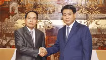 Hanoi, Lao officials share experiences in inspection work