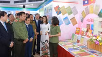 Exhibition featuring Viet – Lao People's Security Forces’ friendship opens in Hanoi