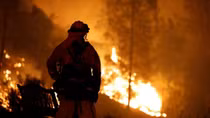 Monster wildfire in California rages on after killing two firefighters