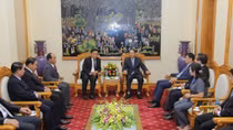 Deputy Minister Le Quy Vuong receives delegation of Lao Police 